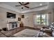 Comfortable living room featuring a mounted TV, recessed lights, hardwood flooring and a large window at 113 Adelphia Rd., Loris, SC 29569