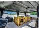 Well-equipped outdoor kitchen with wooden frame, BBQ, sink, and grill, perfect for outdoor entertaining at 113 Adelphia Rd., Loris, SC 29569