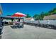 Inviting outdoor patio with a dining set under a large umbrella, perfect for entertaining and relaxation at 113 Adelphia Rd., Loris, SC 29569