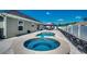 Relaxing backyard with a pool and a spa featuring clear, refreshing water and stone details at 113 Adelphia Rd., Loris, SC 29569