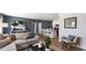 Stylish living room with a comfortable sofa and a view into the kitchen and dining area at 1170 Silver Perch Place, Sunset Beach, NC 28468