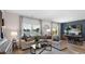 Elegant living room featuring a comfortable sectional sofa and a picturesque view of the lake at 1170 Silver Perch Place, Sunset Beach, NC 28468
