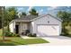 Charming single-story home featuring a two-car garage, well-maintained lawn, and welcoming front porch at 1171 Silver Perch Place, Sunset Beach, NC 28468