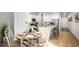 Inviting kitchen with breakfast nook, white cabinets, stainless steel appliances, and granite countertops at 1171 Silver Perch Place, Sunset Beach, NC 28468
