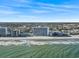 A scenic beach view of the high-rise resort on the shoreline at 1210 N Waccamaw Dr. # 305, Murrells Inlet, SC 29576
