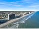 A panoramic view of the shoreline featuring the high-rise resort and ocean at 1210 N Waccamaw Dr. # 305, Murrells Inlet, SC 29576