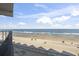 Balcony ocean view with white sands and blue ocean at 1210 N Waccamaw Dr. # 305, Murrells Inlet, SC 29576
