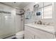Bathroom featuring a modern vanity with a marble countertop, glass shower, and contemporary fixtures at 1210 N Waccamaw Dr. # 305, Murrells Inlet, SC 29576
