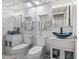 Bright bathroom featuring a glass bowl sink, modern fixtures, and a decorative tin-style ceiling at 1210 N Waccamaw Dr. # 305, Murrells Inlet, SC 29576