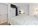 Cozy bedroom with full sized bed, white dresser and wall-mounted television at 1210 N Waccamaw Dr. # 305, Murrells Inlet, SC 29576