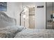Comfortable bedroom with queen bed, reading lamp and sliding closet doors leading to a private bathroom at 1210 N Waccamaw Dr. # 305, Murrells Inlet, SC 29576