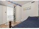 Bedroom view featuring an open door, fish-themed decor and wood-style flooring at 1210 N Waccamaw Dr. # 305, Murrells Inlet, SC 29576