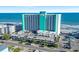 A full view of the oceanfront resort showcasing architecture and parking at 1210 N Waccamaw Dr. # 305, Murrells Inlet, SC 29576