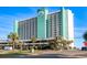Exterior facade of the Royal Garden Resort showcasing its oceanfront location and multiple floors with private balconies at 1210 N Waccamaw Dr. # 305, Murrells Inlet, SC 29576