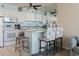 Kitchen area featuring modern appliances, a breakfast bar, and bar stool seating at 1210 N Waccamaw Dr. # 305, Murrells Inlet, SC 29576
