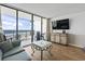 Comfortable living room with balcony access and stunning ocean views at 1210 N Waccamaw Dr. # 305, Murrells Inlet, SC 29576