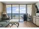 Comfortable living room opens to a balcony with stunning ocean views at 1210 N Waccamaw Dr. # 305, Murrells Inlet, SC 29576