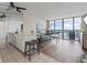 Bright living room features an ocean view and comfortable seating, with a kitchen area nearby at 1210 N Waccamaw Dr. # 305, Murrells Inlet, SC 29576