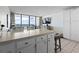 Cozy living space with tiled floors flowing onto the oceanfront balcony view at 1210 N Waccamaw Dr. # 305, Murrells Inlet, SC 29576