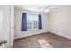 Neutral bedroom with a ceiling fan and a bright window that has blue curtains at 1217 Cymmer Ct., Conway, SC 29527