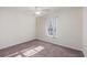 Cozy bedroom features a ceiling fan and sunlit window with light-filtering curtains at 1217 Cymmer Ct., Conway, SC 29527