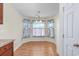 Bright dining nook features a chandelier and natural light from three windows at 1217 Cymmer Ct., Conway, SC 29527