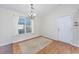 Simple dining area with natural light, wood laminate flooring, and white walls at 1217 Cymmer Ct., Conway, SC 29527
