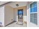 Inviting front entrance with a storm door, welcome mat, and cheerful gnome statues for a warm greeting at 1217 Cymmer Ct., Conway, SC 29527