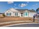 Charming single-story home featuring a well-manicured lawn, vinyl siding, and an attached garage in a friendly neighborhood at 1217 Cymmer Ct., Conway, SC 29527