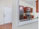 Kitchen features stainless steel appliances, granite countertops and adjacent entry door at 1217 Cymmer Ct., Conway, SC 29527