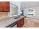 A kitchen sink and countertop with an open view into the living/dining area at 1217 Cymmer Ct., Conway, SC 29527