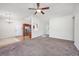 Spacious living room with plush carpeting, ceiling fan, and a welcoming atmosphere with kitchen view at 1217 Cymmer Ct., Conway, SC 29527