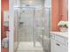 This bathroom showcases a glass enclosed shower and tile-surround, toilet, and storage at 122 New Paradise Way, Myrtle Beach, SC 29588