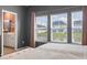 A Primary bedroom boasts great natural light and views of the community's pond at 122 New Paradise Way, Myrtle Beach, SC 29588