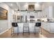 Modern kitchen featuring white cabinets, stainless appliances, black marble counters, and an island at 122 New Paradise Way, Myrtle Beach, SC 29588