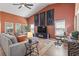 Open-concept living room featuring a stylish accent wall, modern furniture, and a cozy atmosphere for relaxation at 122 New Paradise Way, Myrtle Beach, SC 29588