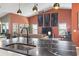 Open-concept living area, featuring a large island connecting the kitchen and cozy seating beneath modern pendant lights at 122 New Paradise Way, Myrtle Beach, SC 29588