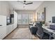 A home office provides a comfortable workspace with great natural light from the plantation shutters at 122 New Paradise Way, Myrtle Beach, SC 29588