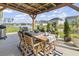 Beautiful outdoor dining area overlooking the water, perfect for entertaining and relaxation at 122 New Paradise Way, Myrtle Beach, SC 29588