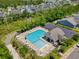 An aerial view of a community pool, showcasing its spacious layout and surrounding amenities at 1290 Prescott Circle, Myrtle Beach, SC 29577
