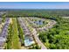 An aerial view that showcases the community, which includes a lake, pool and many homes at 1290 Prescott Circle, Myrtle Beach, SC 29577
