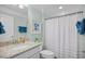 Bright bathroom featuring granite countertops, a framed mirror, and a shower with a curtain at 1290 Prescott Circle, Myrtle Beach, SC 29577