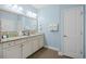 Well-lit bathroom features vanity with granite countertops and ample cabinet space at 1290 Prescott Circle, Myrtle Beach, SC 29577