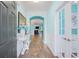 Inviting entryway with hardwood floors, white wainscoting, and an arched doorway at 1290 Prescott Circle, Myrtle Beach, SC 29577