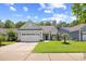 Charming single-story home with a well-manicured lawn, two-car garage, and inviting curb appeal at 1290 Prescott Circle, Myrtle Beach, SC 29577
