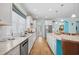 Bright kitchen with granite countertops, stainless appliances and a large island with seating at 1290 Prescott Circle, Myrtle Beach, SC 29577