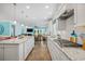 Modern kitchen with white cabinets, granite countertops, hardwood floors, and open layout at 1290 Prescott Circle, Myrtle Beach, SC 29577