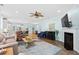 Bright, open-concept living room with hardwood floors, fireplace, and view into the kitchen at 1290 Prescott Circle, Myrtle Beach, SC 29577