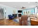 Light-filled living room featuring a fireplace, hardwood floors, and comfortable seating arrangement at 1290 Prescott Circle, Myrtle Beach, SC 29577