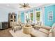 Comfortable living room area with multiple chairs, ceiling fan, and natural light from many windows at 1290 Prescott Circle, Myrtle Beach, SC 29577